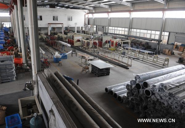 A powered-off workshop is seen empty in Wenzhou, east China’s Zhejiang Province, June 30, 2011. © Xinhua
