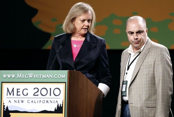 California Republican gubernatorial candidate Meg Whitman (L) chats with her senior advisor Henry Gomez during a walk-through for her election night party in Los Angeles, California, June 8, 2010. ©Reuters