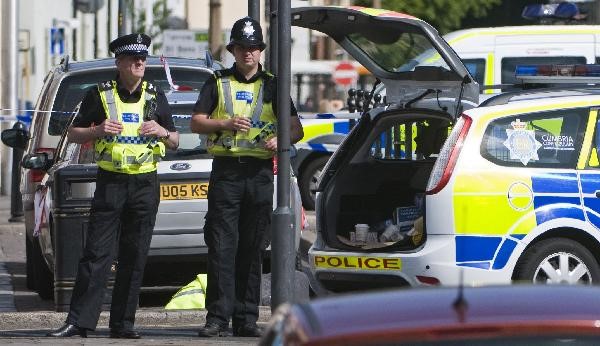 Police stand guard at the shooting site in Cumbria, northern England, June 2. Twelve people were killed and at least 25 others injured after a gunman carried out a series of shootings in Cumbria, northern England, local police confirmed on Wednesday. ©AFP