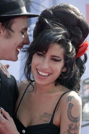 Singer Amy Winehouse and husband Blake Fielder-Civil attend the 2007 MTV Movie Awards in Los Angeles, California in this June 3, 2007 file photo. Winehouse received six nominations for the 50th annual Grammy Awards, announced December 6, 2007. ©Reuters